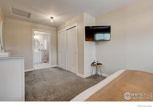 unfurnished bedroom with carpet flooring, attic access, baseboards, visible vents, and a closet