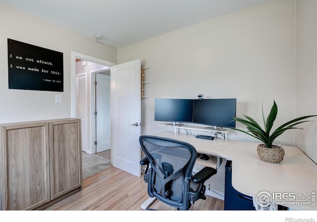 home office featuring light wood-style flooring