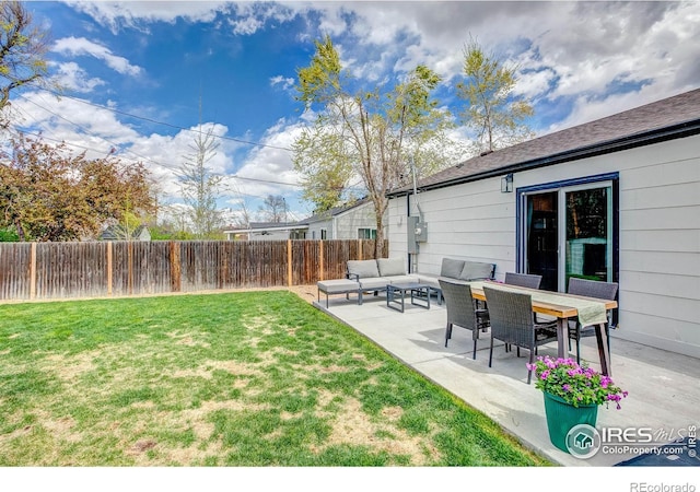 view of yard with a fenced backyard, a patio, and outdoor lounge area