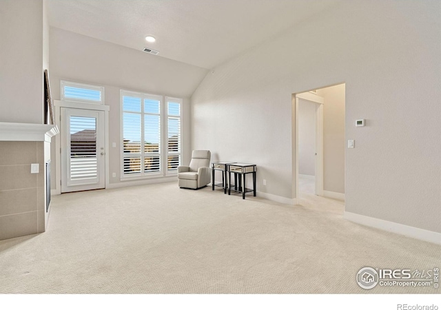 2751 Iowa Dr Unit 305, Fort Collins, CO 80525 - living area featuring vaulted ceiling, carpet, and baseboards