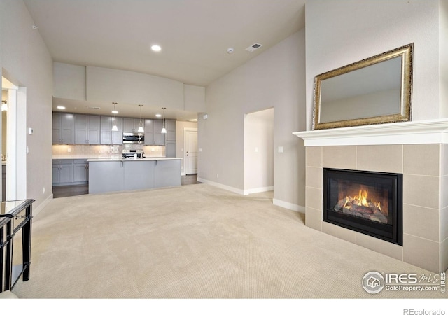 2751 Iowa Dr Unit 305, Fort Collins, CO 80525 - unfurnished living room with carpet, recessed lighting, baseboards, and a tiled fireplace
