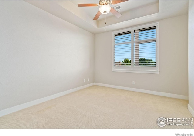 2751 Iowa Dr Unit 305, Fort Collins, CO 80525 - empty room featuring carpet, baseboards, ceiling fan, and a tray ceiling