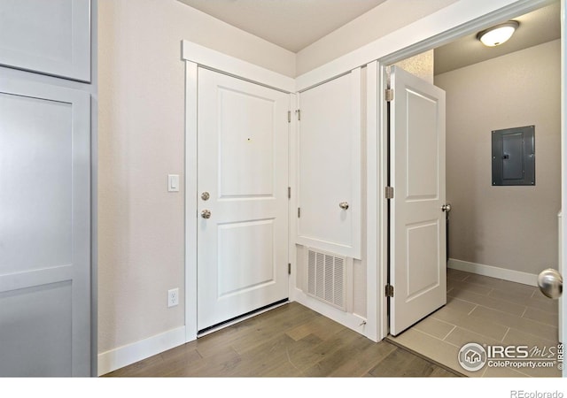 2751 Iowa Dr Unit 305, Fort Collins, CO 80525 - entryway with electric panel, baseboards, and wood finished floors