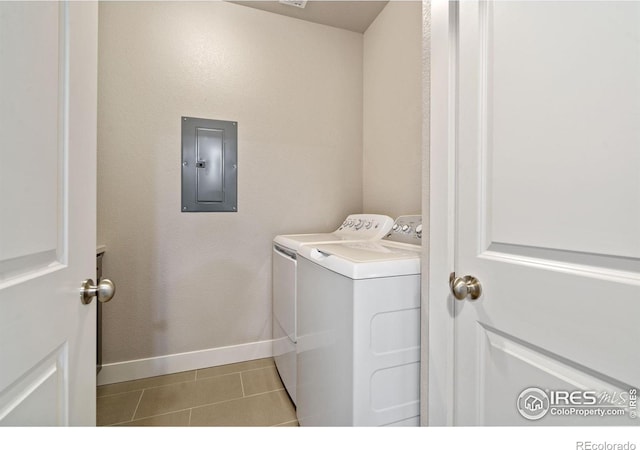 2751 Iowa Dr Unit 305, Fort Collins, CO 80525 - washroom with electric panel, washer and dryer, baseboards, and tile patterned flooring