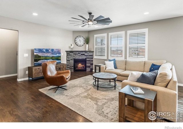 2121 Covered Bridge Pkwy, Windsor, CO 80550 - living area featuring a fireplace, baseboards, recessed lighting, a ceiling fan, and dark wood finished floors