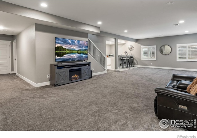 2121 Covered Bridge Pkwy, Windsor, CO 80550 - carpeted living area with baseboards, recessed lighting, and stairs