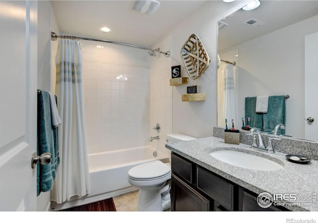 full bath featuring toilet, visible vents, shower / bath combination with curtain, and vanity