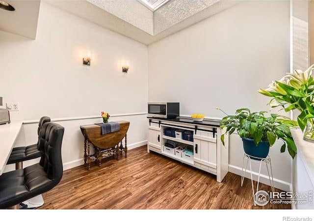 15503 E Wyoming Dr Unit G, Aurora, CO 80017 - office with wood finished floors, lofted ceiling, and baseboards