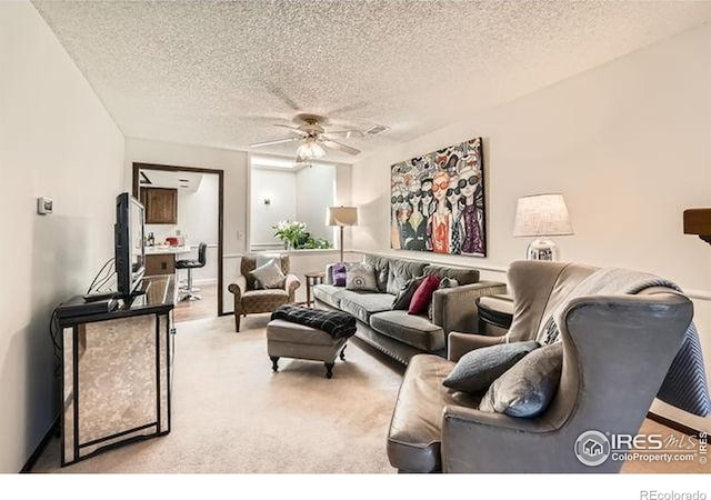 15503 E Wyoming Dr Unit G, Aurora, CO 80017 - carpeted living area featuring ceiling fan and a textured ceiling