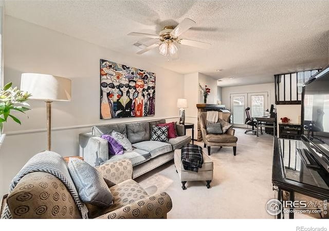 15503 E Wyoming Dr Unit G, Aurora, CO 80017 - living area featuring carpet, a ceiling fan, and a textured ceiling