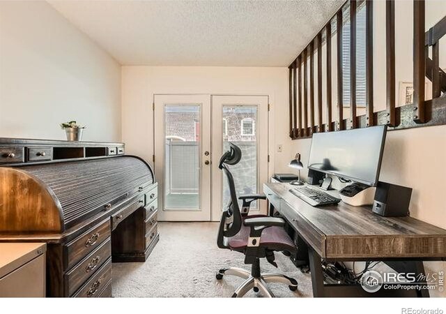 15503 E Wyoming Dr Unit G, Aurora, CO 80017 - office space featuring light colored carpet, french doors, and a textured ceiling