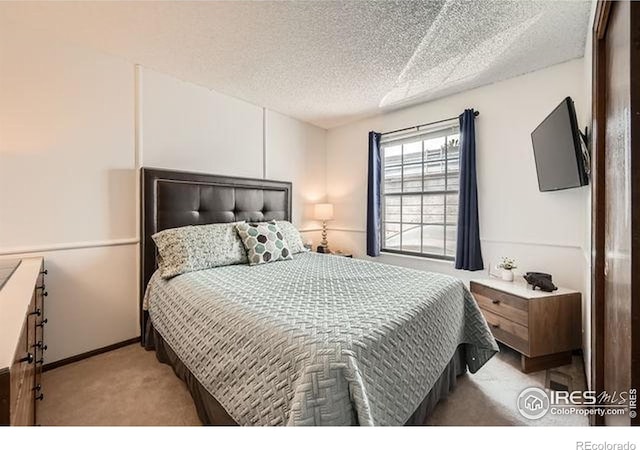15503 E Wyoming Dr Unit G, Aurora, CO 80017 - bedroom with carpet and a textured ceiling