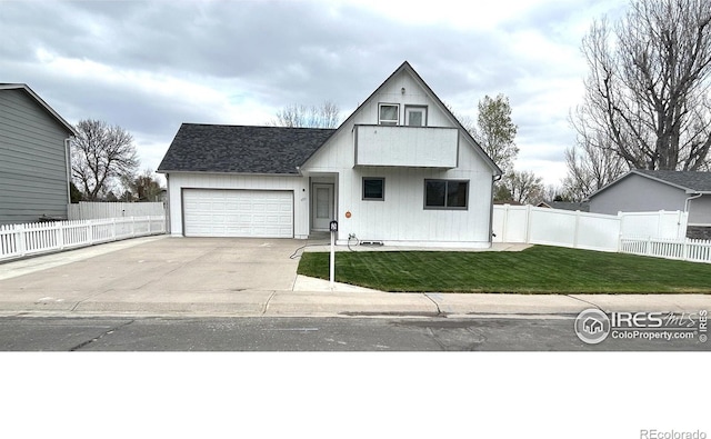 425 Stanford St, Brush, CO 80723 - view of front of home featuring concrete driveway, an attached garage, and a shingled roof
