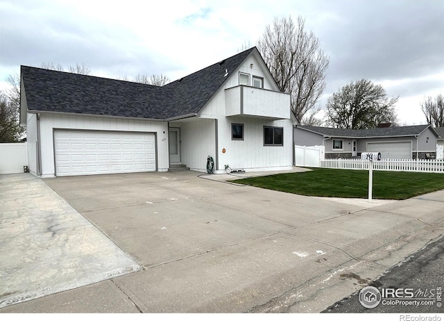 425 Stanford St, Brush, CO 80723 - view of front of house featuring an attached garage, driveway, and roof with shingles