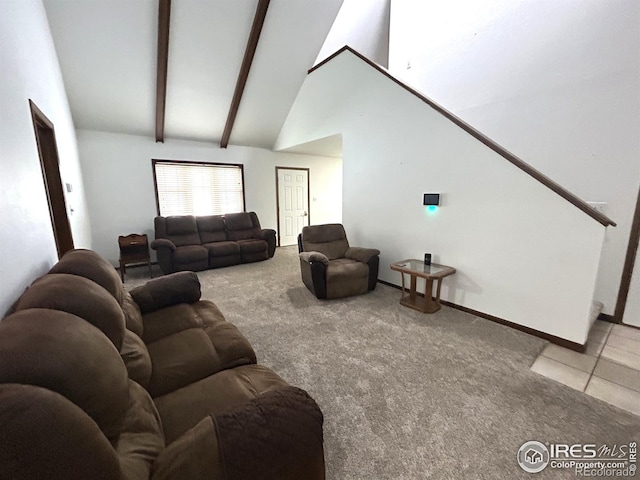 425 Stanford St, Brush, CO 80723 - carpeted living room with beamed ceiling, tile patterned flooring, baseboards, and high vaulted ceiling