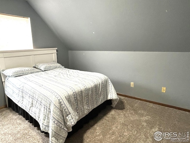 425 Stanford St, Brush, CO 80723 - carpeted bedroom with lofted ceiling and baseboards