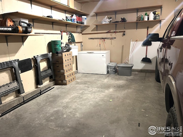 425 Stanford St, Brush, CO 80723 - below grade area featuring white fridge and a garage