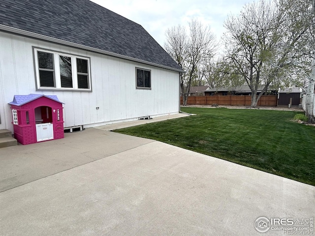 425 Stanford St, Brush, CO 80723 - view of side of home with a patio area and roof with shingles