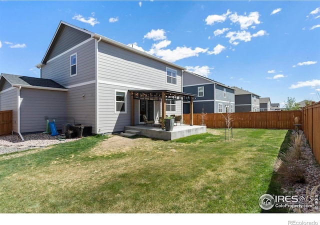 3759 Catmint St, Wellington, CO 80549 - rear view of property with a fenced backyard, a patio, and a lawn