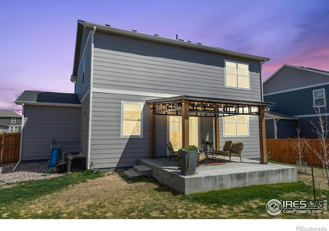 3759 Catmint St, Wellington, CO 80549 - rear view of property featuring a patio, a lawn, fence, and cooling unit