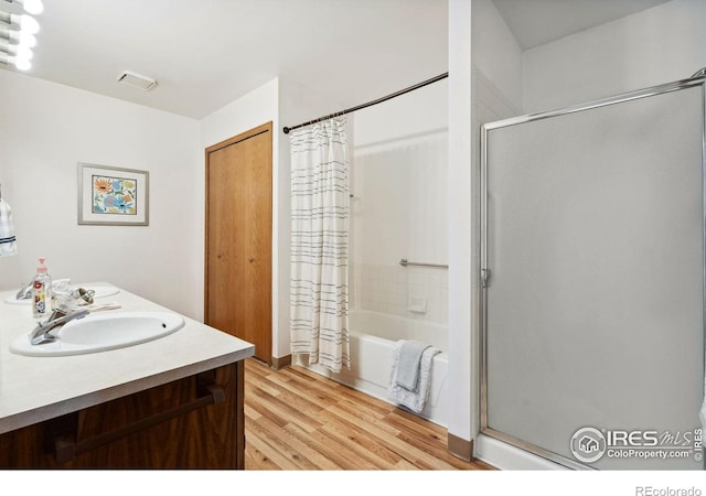 4560 Larkbunting Dr Unit 2B, Fort Collins, CO 80526 - bathroom with wood finished floors, shower / tub combo, and double vanity