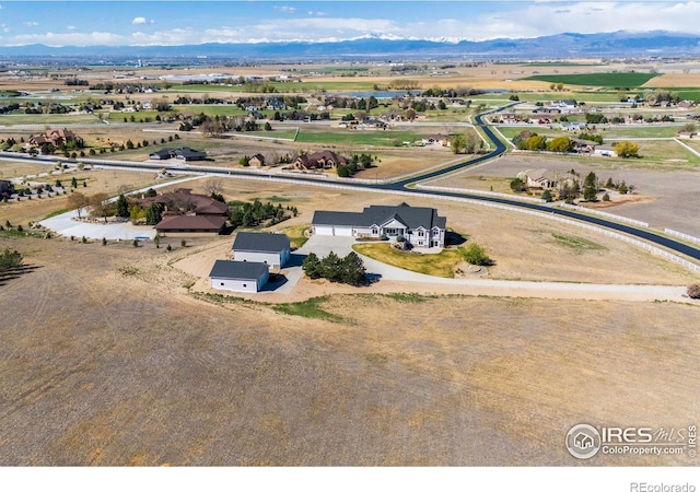 bird's eye view with a mountain view and a rural view