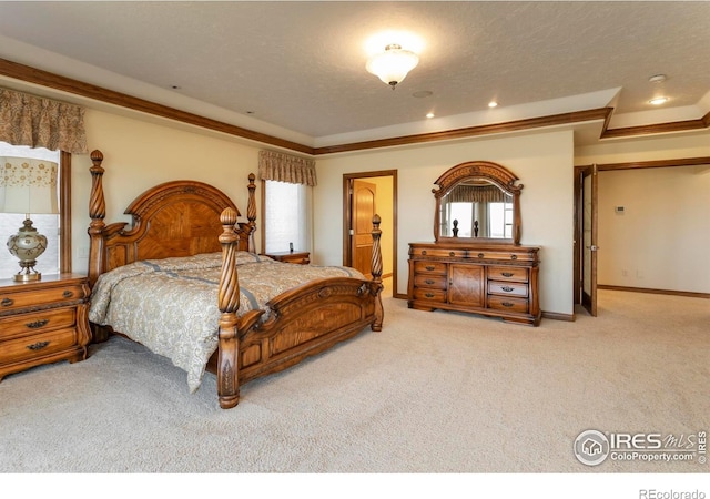 carpeted bedroom with baseboards and ornamental molding