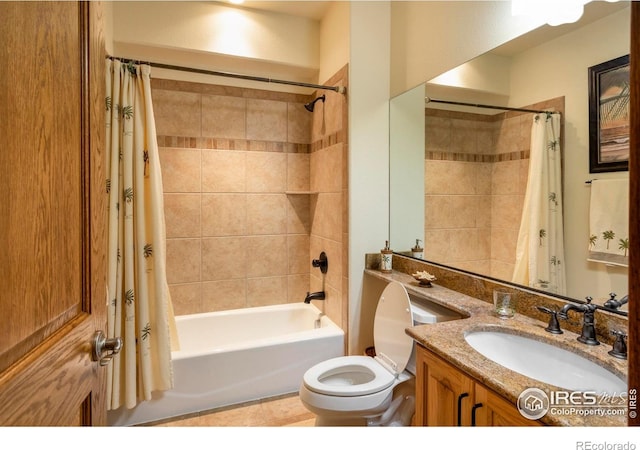 bathroom with toilet, shower / bath combination with curtain, and vanity
