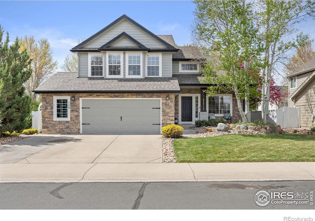 109 Whitney Ct, Windsor, CO 80550 - craftsman house with a garage, driveway, a shingled roof, and stone siding