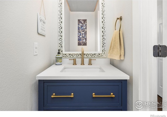 109 Whitney Ct, Windsor, CO 80550 - bathroom with vanity and a textured wall