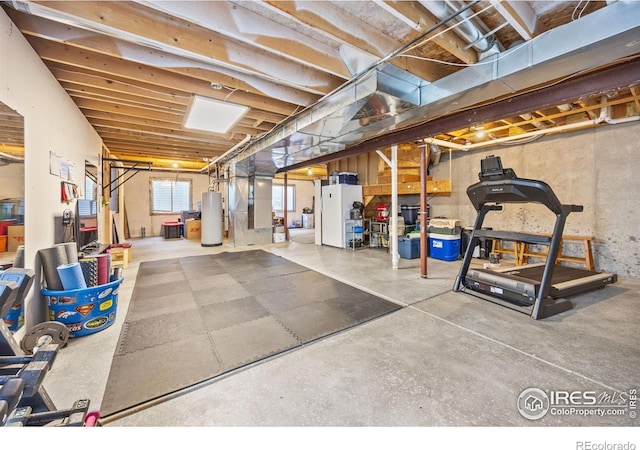 109 Whitney Ct, Windsor, CO 80550 - basement with water heater and freestanding refrigerator