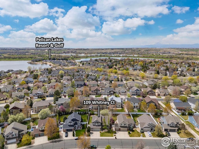 109 Whitney Ct, Windsor, CO 80550 - aerial perspective of suburban area featuring a large body of water