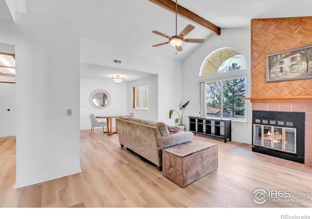 5035 W 73rd Ave, Westminster, CO 80030 - living area with a wealth of natural light, beamed ceiling, ceiling fan, and visible vents