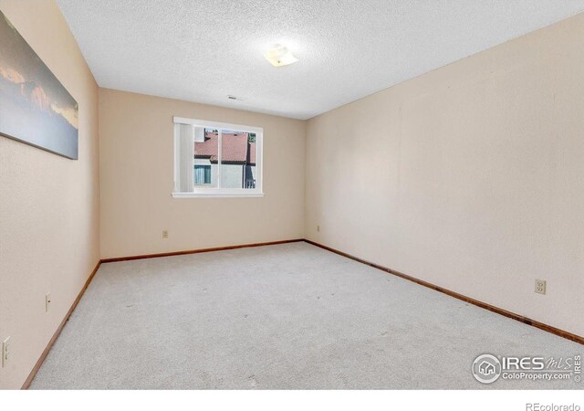 5035 W 73rd Ave, Westminster, CO 80030 - spare room featuring carpet flooring, a textured ceiling, and baseboards