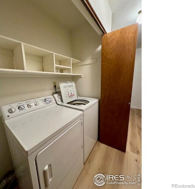 5035 W 73rd Ave, Westminster, CO 80030 - washroom featuring washing machine and dryer, laundry area, and light wood finished floors