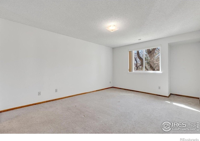 5035 W 73rd Ave, Westminster, CO 80030 - spare room with a textured ceiling, baseboards, and carpet