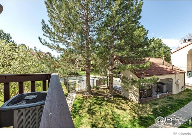 5035 W 73rd Ave, Westminster, CO 80030 - wooden deck with central AC and fence