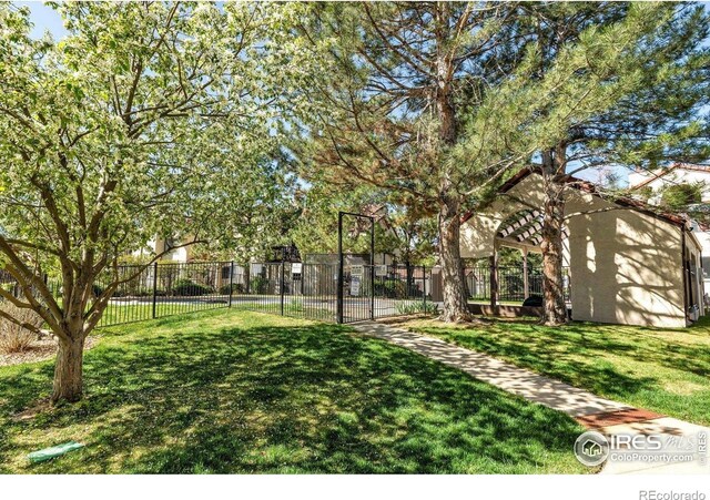 5035 W 73rd Ave, Westminster, CO 80030 - view of yard featuring a pergola and fence