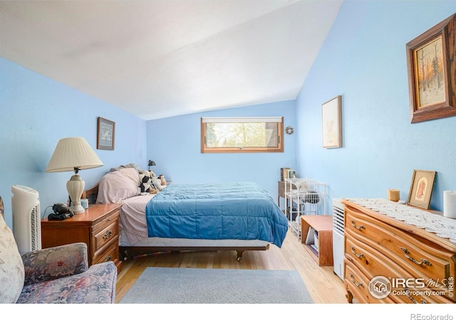 1800 Sumac Ave, Boulder, CO 80304 - bedroom with vaulted ceiling and light wood-style flooring