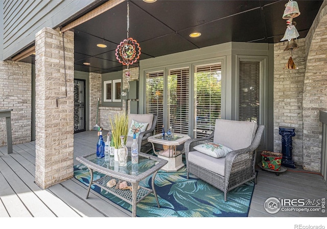 wooden terrace with a porch