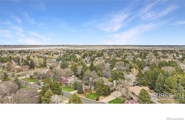 drone / aerial view with a water view and a residential view