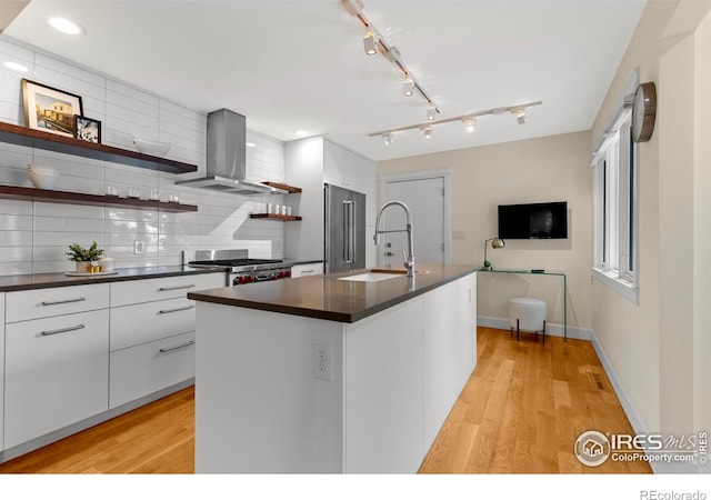 kitchen featuring dark countertops, modern cabinets, open shelves, and extractor fan