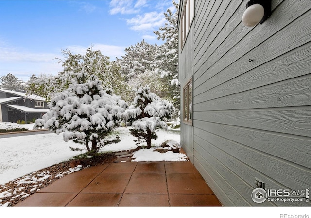 view of snow covered property