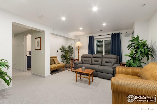 carpeted living room featuring recessed lighting, baseboards, and visible vents