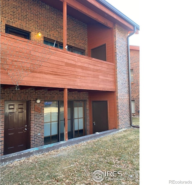 1961 Centennial Dr, Louisville, CO 80027 - rear view of property featuring brick siding and a balcony
