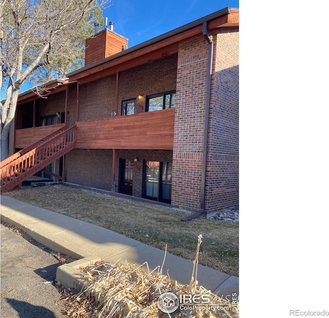 1961 Centennial Dr, Louisville, CO 80027 - view of property featuring stairway