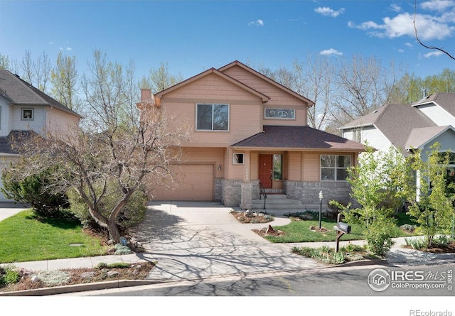 4866 Franklin Dr, Boulder, CO 80301 - traditional-style home featuring driveway, a chimney, stone siding, and a garage