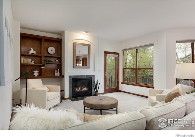 4866 Franklin Dr, Boulder, CO 80301 - carpeted living area featuring baseboards, a healthy amount of sunlight, and a fireplace