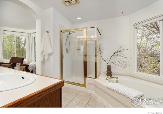 4866 Franklin Dr, Boulder, CO 80301 - bathroom with tile patterned floors, a stall shower, and a wealth of natural light