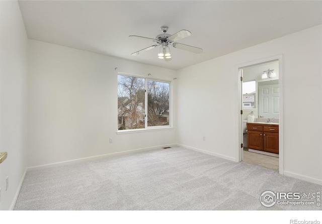 4866 Franklin Dr, Boulder, CO 80301 - unfurnished bedroom with ceiling fan, a sink, baseboards, ensuite bathroom, and light carpet